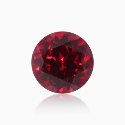 round cut lab grown pigeon blood sapphire